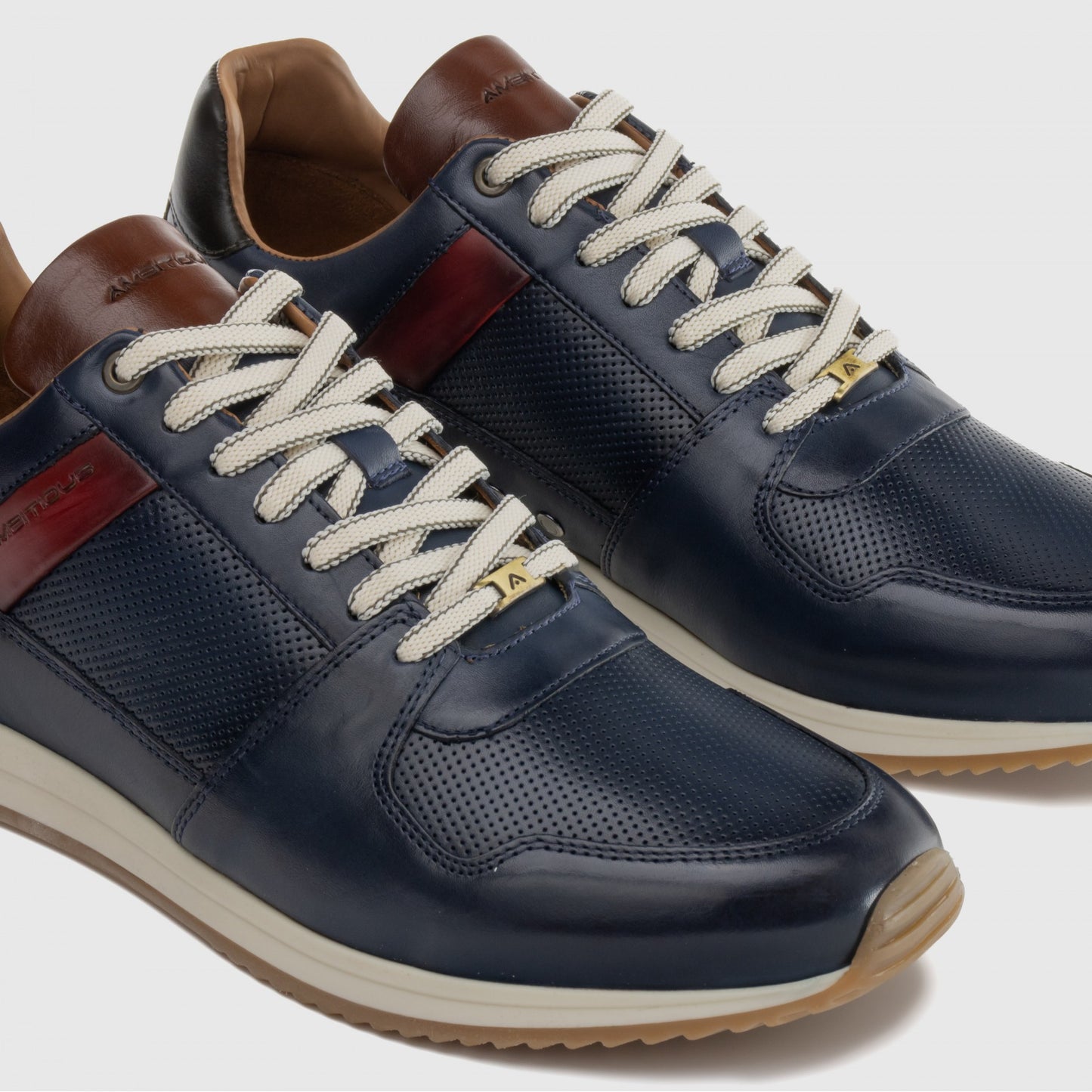 NAVY TRAINERS WITH BROWN AND RED DESIGN