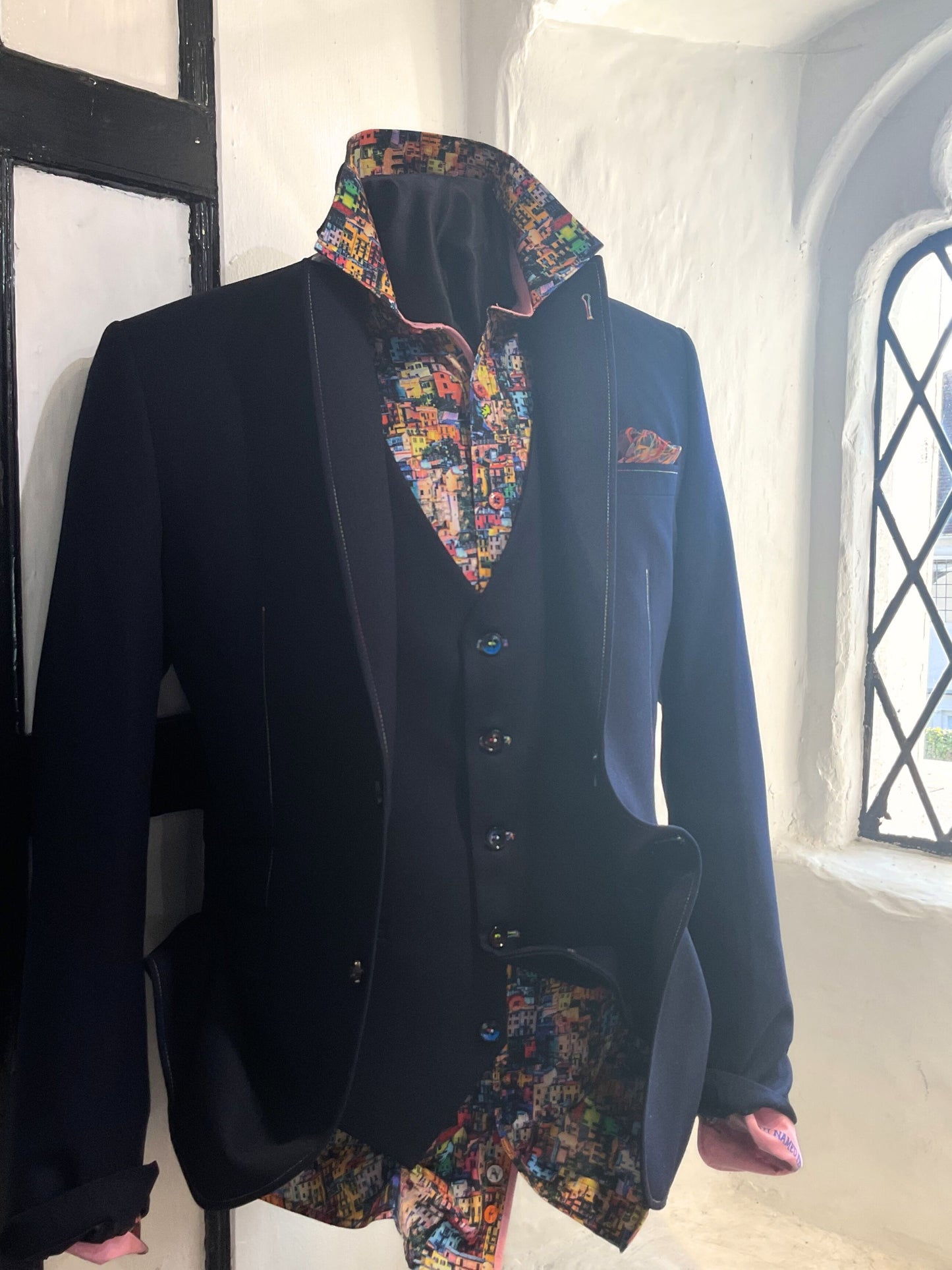 NAVY SPORTS JACKET WITH RAINBOW TRIM AND SPLASH PRINT LINING